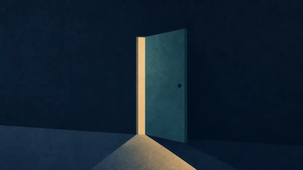 A door standing ajar with light in the gap