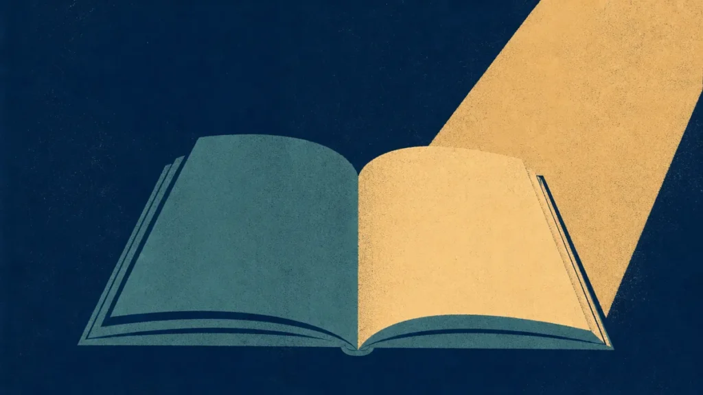 An open book with light falling on one page